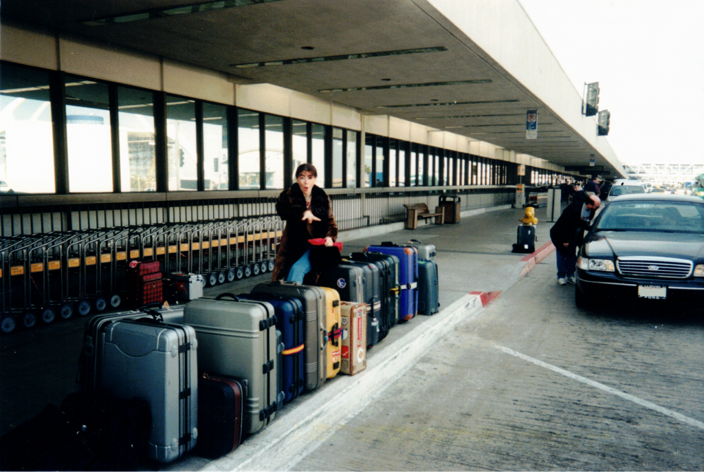 Evelyn outside a US airport in 1999 with a lot of luggage