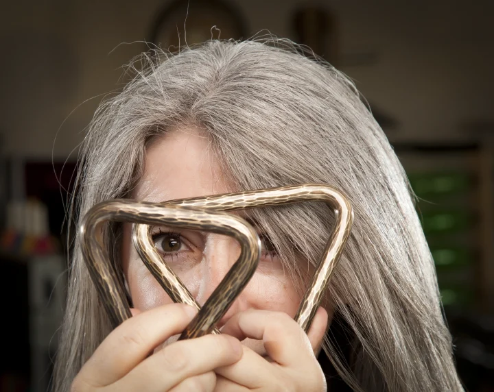 CHECK 1 Evelyn with her collection of Matt Nolan Custom triangles - © Andy McCreeth - photo ref AM 3110 s